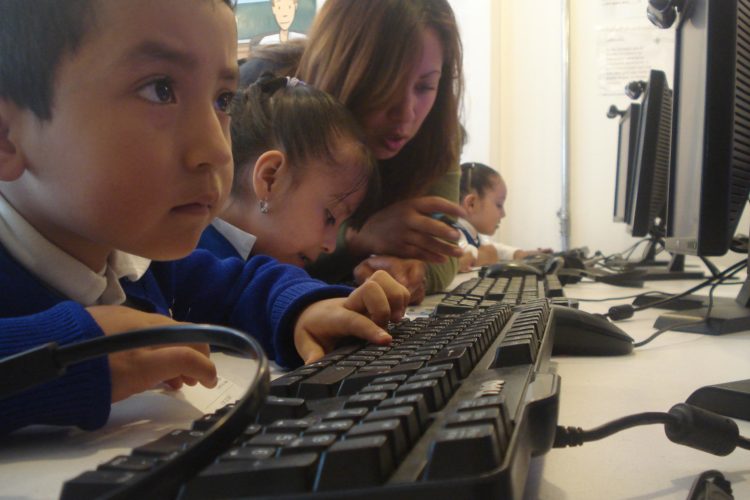 Kids learning to use computer